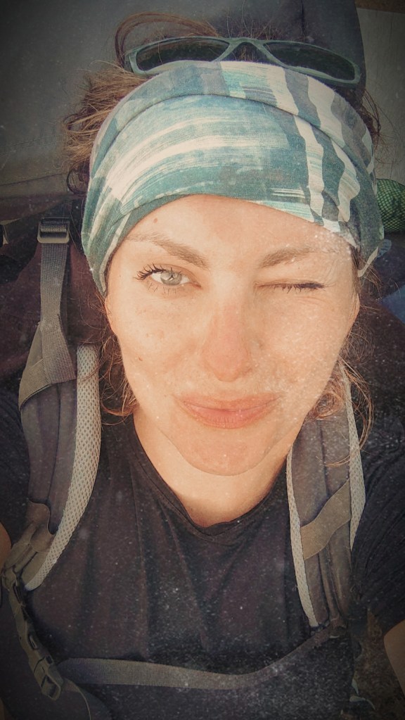 Face of a woman wearing buff